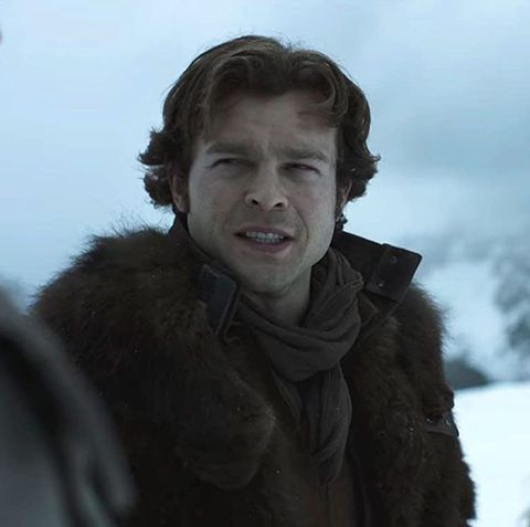 solo a star wars story   alden ehrenreich as han solo, standing in the snow with chewbacca joonas suotamo