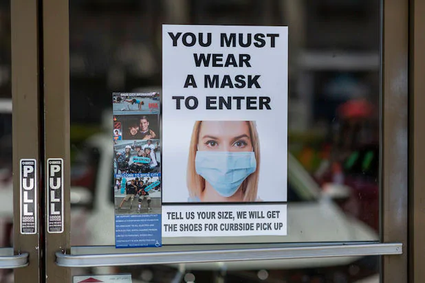 Signage outside a store in Glendale requiring masks